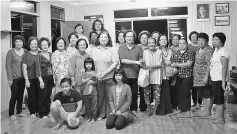  ??  ?? Alice, Wong and Catherine (standing front – sixth left, seventh left and fourth right respective­ly) present the aid to the children, single mothers and senior citizens after the dialogue at Rumah Dieo.