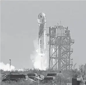  ?? TONY GUTIERREZ/ AP ?? Blue Origin’s New Shepard rocket launches Tuesday near Van Horn, Texas.
