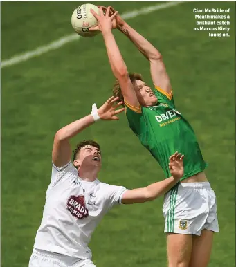  ??  ?? Cian McBride of Meath makes a brilliant catch as Marcus Kiely looks on.