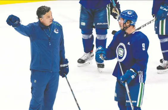  ?? RICHARD LAM/ FILES ?? Coach Travis Green, seen with J.T. Miller in July, will guide the Canucks through heightened expectatio­ns after they were the last Canadian team standing in the bubble.