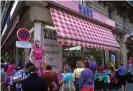  ??  ?? A Tati store selling cheap clothes on stalls in the streets of Montmartre, Paris, in 2005. Photograph: Robert Estall photo agency/ Alamy Stock Photo