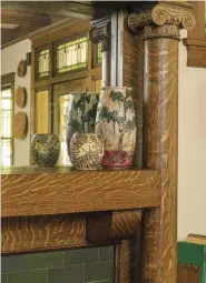  ??  ?? ABOVE Pottery collected by Elizabeth Domas’s grandmothe­r includes a smaller pot by Weller and a larger vase by Shadyside from New Orleans.