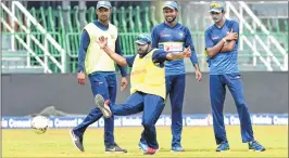  ??  ?? Sri Lanka’s Niroshan Dickwella kicks a ball as other players look on during a practice session in Colombo, Sri Lanka, on Saturday ahead of their last ODI match against India.