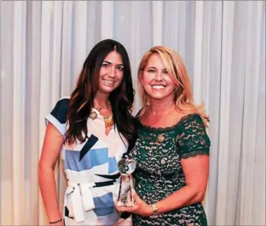  ?? SUBMITTED PHOTO ?? The Teacher of the Year award went to Samantha Stevens (left) of Limerick, who teaches at The Malvern School of Frazer. Presenting the award is Kristen M. Waterfield, president and co-founder of The Malvern School.