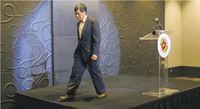  ?? PATRICK SEMANSKY/AP ?? University of Maryland President Wallace Loh walks off stage after speaking at a news conference to address the school’s football program and the death of offensive lineman Jordan McNair, who collapsed on a practice field and subsequent­ly died.