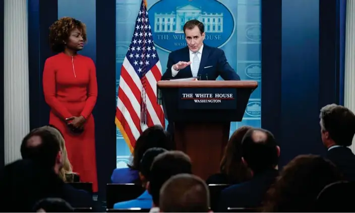  ?? Photograph: Mandel Ngan/AFP/Getty Images ?? The White House press secretary, Karine Jean-Pierre, watches as John Kirby, national security council spokespers­on, speaks on Monday.