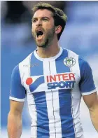  ??  ?? Will Grigg was on the scoresheet for Wigan against Dale last night