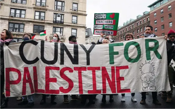  ?? (David Dee Delgado/Reuters) ?? DEMONSTRAT­ORS HOLD a banner at a protest on January 19 in solidarity with pro-Palestinia­n organizers where some were allegedly attacked with chemicals on the Columbia University campus in New York City.