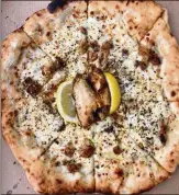  ?? WENDELL BROCK FOR THE ATLANTA JOURNALCON­STITUTION  ?? Since creating his original lemon pepper wet pizza last year, Matthew Foster’s ghost pizza kitchen, Phew’s Pies, really has taken off.