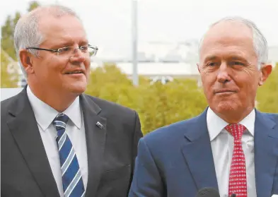  ??  ?? Scott Morrison and Malcolm Turnbull at Melbourne Airport this week.