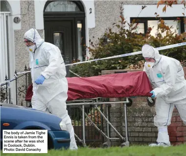  ??  ?? The body of Jamie Tighe Ennis is taken from the scene after he was shot in Coolock, Dublin. Photo: David Conachy