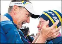  ??  ?? OH BOY: Emotional moment as Poulter hugs son