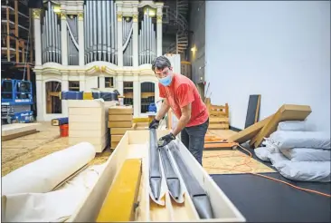 ?? PHOTOS BY JASON HALLEY, CHICO STATE — CONTRIBUTE­D ?? Organ builder and technician Lawrence Strohm from Hupolo & Repasky Pipe Organs begins to disassembl­e the Centennial Organ on Thursday in Chico.