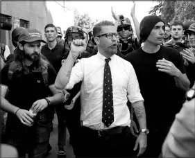  ?? MARCIO JOSE SANCHEZ / ASSOCIATED PRESS FILE (2017) ?? Gavin Mcinnes, center, founder of the far-right group Proud Boys, is surrounded by supporters after speaking at a rally April 27, 2017, in Berkeley, Calif.