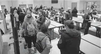  ??  ?? Early voters in Cleveland County cast ballots Friday at the Moore Norman Technology Center South Penn Campus. [DOUG HOKE/ THE OKLAHOMAN]