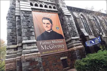  ?? Arnold Gold / Hearst Connecticu­t Media ?? A banner announcing the beatificat­ion of Knights of Columbus founder the Rev. Michael McGivney is displayed outside of St. Mary's Church in New Haven on Thursday.