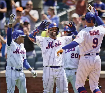  ?? SETH WENIG — THE ASSOCIATED PRESS ?? New York Mets’ Marcus Stroman, left, and Jonathan Villar, center, greet Brandon Nimmo (9) after he hit a three-run homer during the second inning of a baseball game against the Washington Nationals at Citi Field, Thursday, Aug. 12, 2021, in New York.