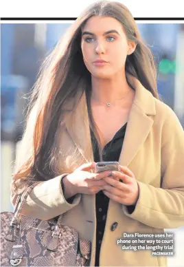  ?? PACEMAKER ?? Dara Florence uses her phone on her way to court
during the lengthy trial