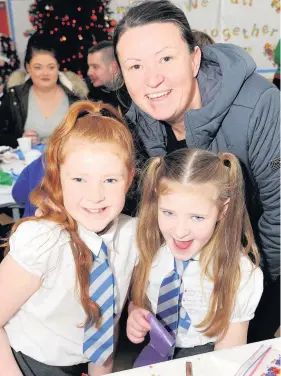  ??  ?? Festive fun Fiona Harris with her daughters Evie O’Hara, left, and Ruby O’Hara