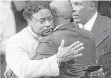  ?? Associated Press file ?? Bishop Eddie Long, left, embraces a friend in 2010 after a scandal erupted in which four young men accused him of sexual misconduct. The cases were settled out of court.