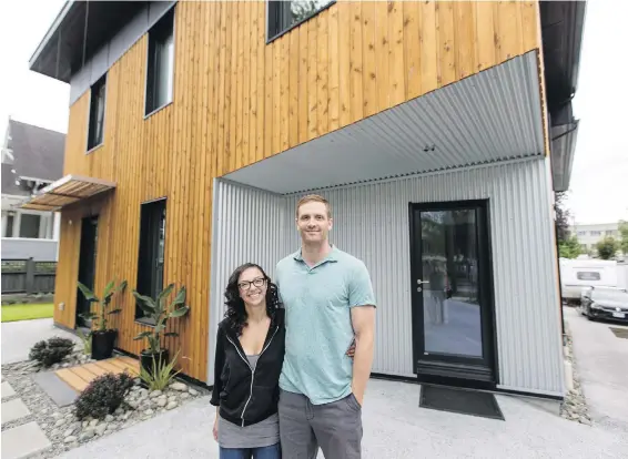  ??  ?? Homeowners Aneesa Blake and Reed Cassidy fell in love with the look of the cedar siding on their Passive House. The original plan was to paint it grey, but the couple likes its contrast with the corrugated steel.