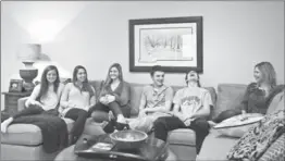  ?? BRYAN ANSELM, NYT ?? Matt DeBoer laughs with his mother, Sue, right, and his sister, Abby, third from left, as they watch a hockey game at home in Madison, N.J.