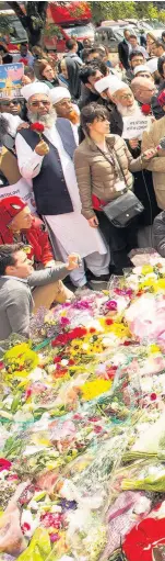  ??  ?? > British imams and other religious leaders hold a vigil near the scene of Saturday’s terrorist attack at London Bridge