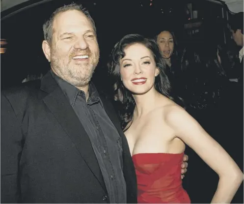  ??  ?? Harvey Weinstein and Rose Mcgowan on the red carpet at an LA film premiere in 2007. She has since accused him of raping her