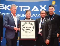  ??  ?? AIRASIA Group Cabin Crew Head Suhaila Hassan (center), AirAsia ambassador David Foster (left) and Brazilian football player Roberto Carlos (third from left), accepted the World’s Best Low-Cost Airline award for the AirAsia Group at an award ceremony in...