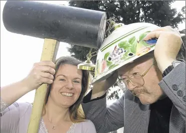  ?? Picture: Andy Payton ?? Natalie Boult gives competitio­n organiser Mike Dunn a whack at his April Fools’ Day competitio­n behind the Swan pub, Broad Street, Sutton Valence