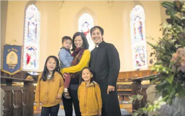  ?? PHOTOS: JAMES BECK ?? Mark Nam is one of the first British-Chinese priests to be ordained into the Church of England. He is pictured with wife Kayi and children, from left; Kimberley, seven, Jamie, two, and Annabel, five