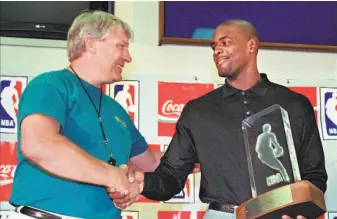  ?? Ben Margot / Associated Press 1994 ?? Warriors coach Don Nelson congratula­tes Chris Webber for winning the 1994 NBA Rookie of the Year award. Webber’s time with the Warriors was short, but now he’s a Hall of Fame finalist.