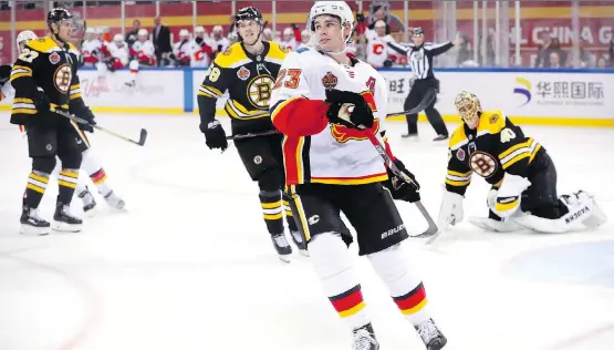  ?? MARK SCHIEFELBE­IN/THE ASSOCIATED PRESS ?? The Flames may have lost both their games in China to the Boston Bruins, but the trip was still “pretty special,” says Sean Monahan.