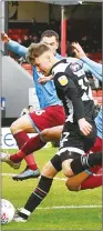  ??  ?? HAVE A GO: Grimsby’s Ethan Robson shoots