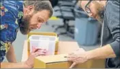  ?? AFP ?? ■ Leon County election officers check the identity on a ballot box ahead of a recount on Saturday in Tallahasse­e, Florida.