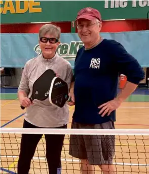  ?? ?? Above: Carol Walsh gears up for a pickleball match with Dennis Pollard, chairman of the Massachuse­tts Senior Games.