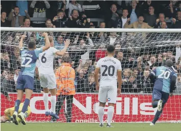  ??  ?? Wycombe made it 3-3 against Posh with a last-gasp penalty from Adebayo Akinfenwa.