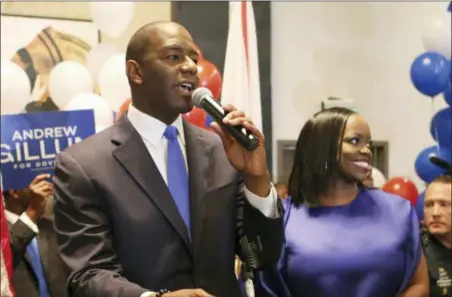  ?? STEVE CANNON — THE ASSOCIATED PRESS ?? Andrew Gillum and his wife, R. Jai Gillum addresses his supporters after Andrew Gillum won the Democratic primary for governor on Tuesday in Tallahasse­e, Fla. Gillum defeated former U.S. Rep. Gwen Graham, the daughter of former U.S. Sen. Bob Graham and four other candidates.