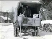  ?? ASSOCIATED PRESS ?? This circa 1940s photo released by the New Hampshire Department of Transporta­tion archives shows salt being applied for anti-icing on a New Hampshire roadway.