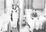  ?? COLUMBIA PICTURES ?? Claudette Colbert, left, and Clark Gable keep things modest in the 1934 hit It Happened One Night.