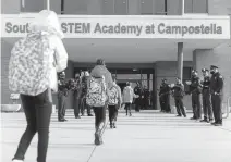  ?? KRISTEN ZEIS/ STAFF ?? Students arrive for the first day of in-person classes at Southside STEM Academy at Campostell­a in Norfolk last week. Historical­ly — even to this day — the funding of Virginia
K-12 schools significan­tly relies upon city or county property taxes.