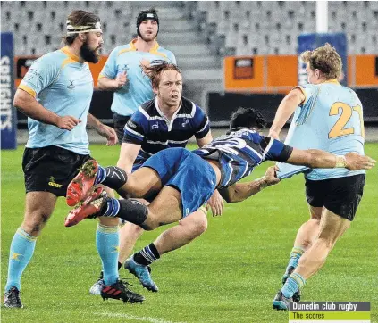  ?? PHOTO: LINDA ROBERTSON ?? Come back . . . Kaikorai midfielder Terence Hepetema dives to tackle University’s Dominic Clapcott. Watching the action are University players (from left) Callum Hardie and Ben Smith with Kaikorai’s Patrick McCurran about to lend the tackler a hand.