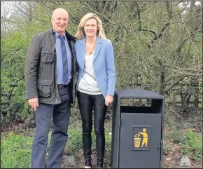  ??  ?? Bins have been installed at lay-bys on Rugby Road on the approach to Burbage from the M69. Pictured are borough councillor­s Mark Nickerson and Amanda Wright who were instrument­al in getting the bins to tackle littering.