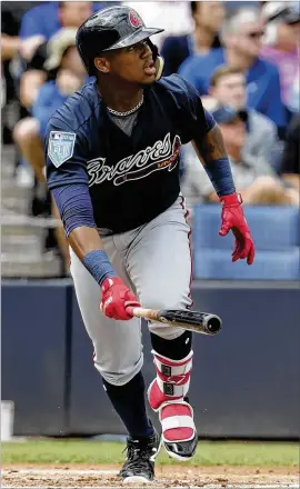  ?? LYNNE SLADKY / ASSOCIATED PRESS ?? Braves left fielder Ronald Acuna hits a two-run home run off Yankees ace Masahiro Tanaka in the first inning Friday. Acuna added two singles.