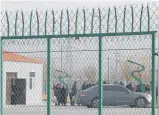  ?? Photo / AP ?? People line up at the Artux City Vocational Skills Education Training Service Centre at the Kunshan Industrial Park in Artux in western China's Xinjiang region.