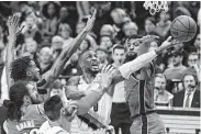  ?? Steve Dipaola / Associated Press ?? Damian Lillard, center, scored 30 points to lift the Blazers over the Thunder in their playoff opener.