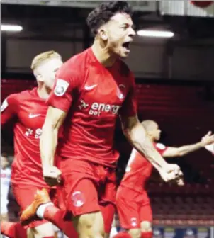  ??  ?? HIGH-FLYING WARRIOR . . . Zimbabwe internatio­nal striker Macauley Bonne celebrates his goal for English side Leyton Orient against Aldershot. — The Guardian