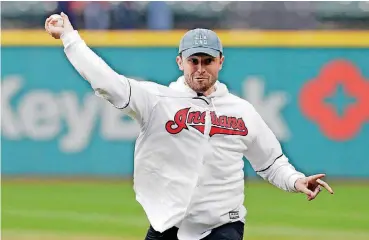  ?? [AP PHOTO] ?? Former Oklahoma quarterbac­k Baker Mayfield throws out the first pitch at an Indians-Mariners game in Cleveland on Friday. Mayfield was the first overall pick in the NFL Draft last week by the Browns.