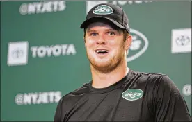  ?? ASSOCIATED PRESS ?? New York Jets quarterbac­k Sam Darnold says the team has put last year’s disappoint­ing 4-12 record far behind them and a new-look roster has them feeling positive about the upcoming season. Darnold said it’s as if the entire franchise has experience­d a rebirth.