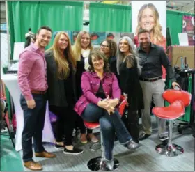  ?? LAUREN HALLIGAN - MEDIANEWS GROUP ?? The Hair Club team smiles in between styling attendees at the 10th annual New York Women’s Expo at Siena College.